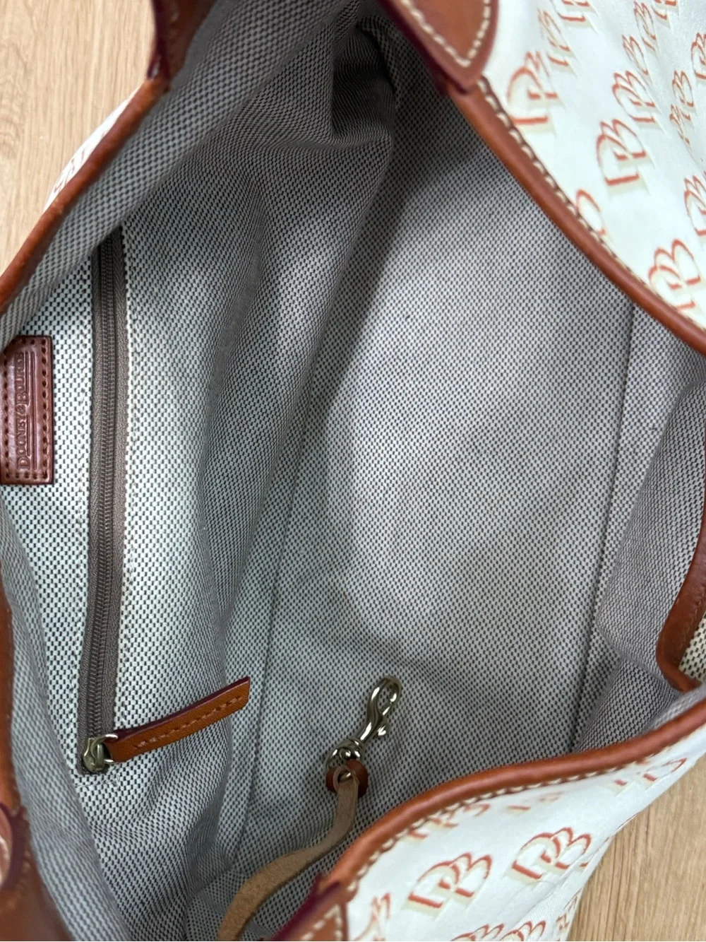 Dooney & Bourke Cream/Brown Signature Logo Lock Canvas Hobo Shoulder Bag